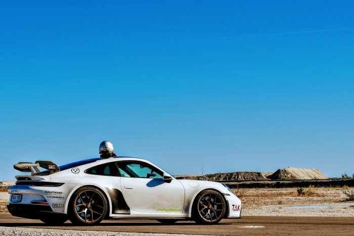 White Porsche 911 Sports Car on Track