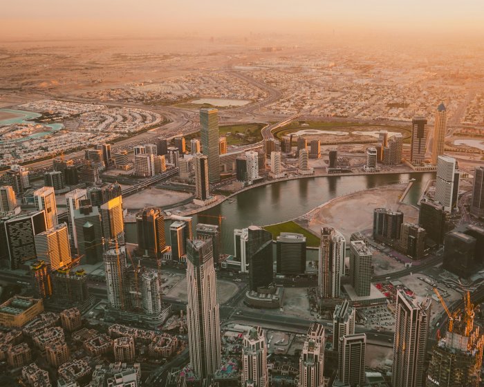 Aerial view of Dubai skyline during golden hour