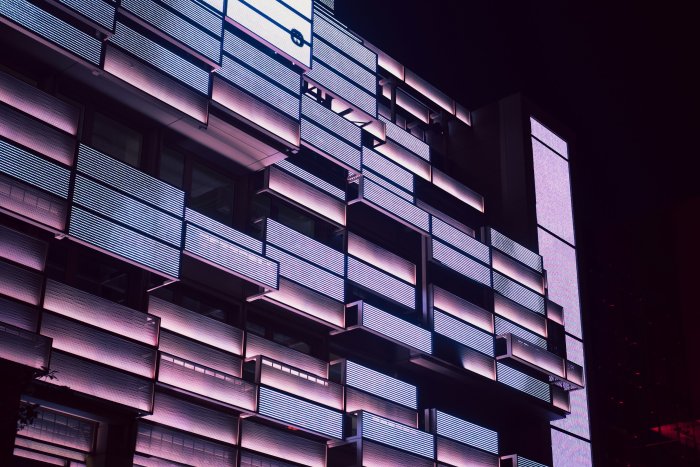Illuminated modern building facade at night in Hamburg