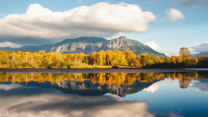 Autumn trees and Mt. Si reflected in Borst Lake