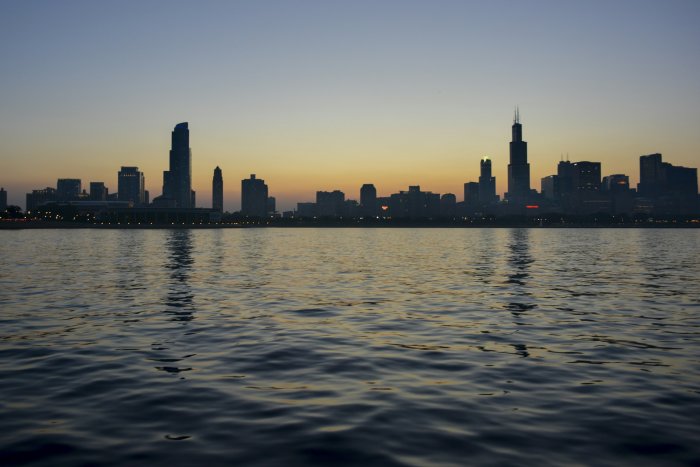Chicago skyline silhouette from Lake Michigan at dusk