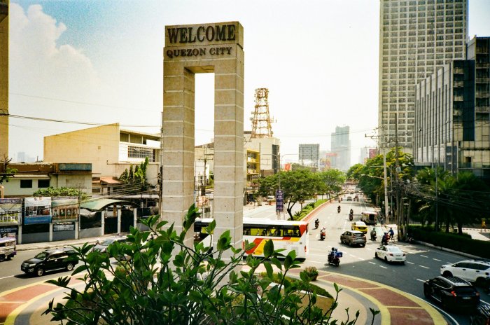Welcome Quezon City Monument and City Street