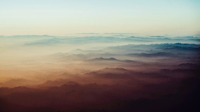 Layered Mountain Ranges Shrouded in Mist