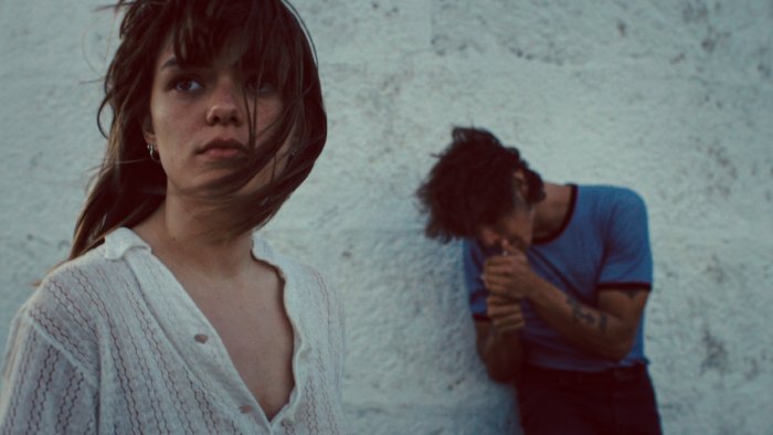 A woman and a man in the movie Romería