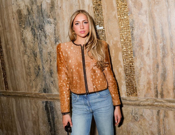Woman in Fawn Print Jacket and Blue Jeans