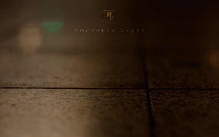Rockstar Games Logo on Dark Textured Floor