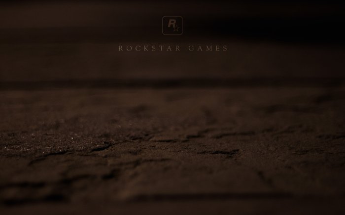 Rockstar Games Logo on Dark Textured Ground