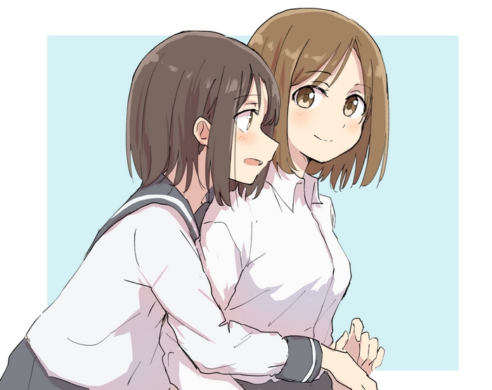 Two girls in school uniforms embracing