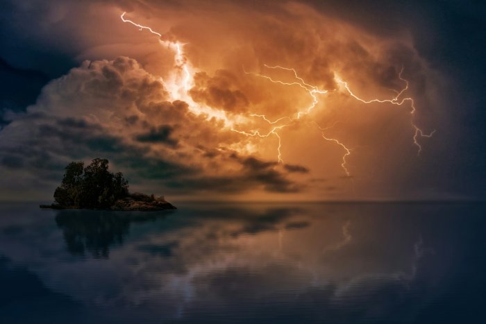 Dramatic lightning storm over a small island