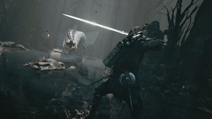 A warrior facing a giant worm in Mortal Shell