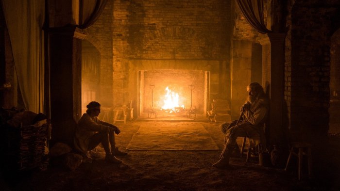 Two men by fireplace in The Death of Robin Hood