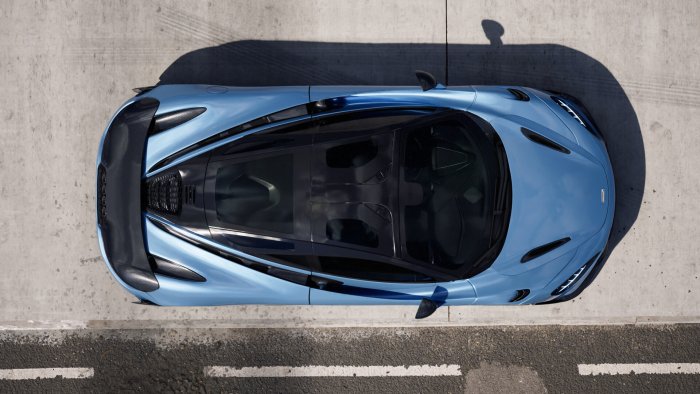 Top-down view of a light blue McLaren sports car