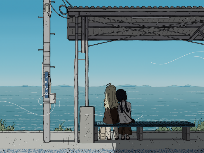Two girls sitting at Shimonada Station overlooking the sea