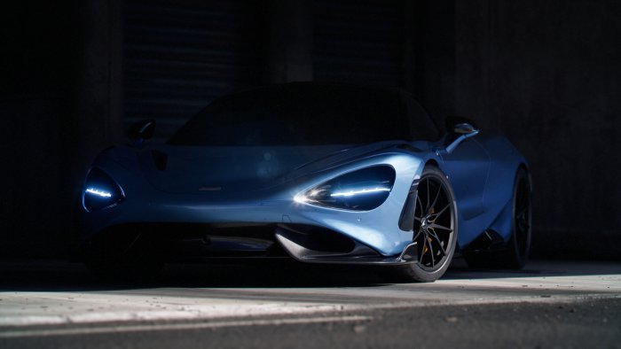 Blue McLaren 720S Sports Car in Dark Garage