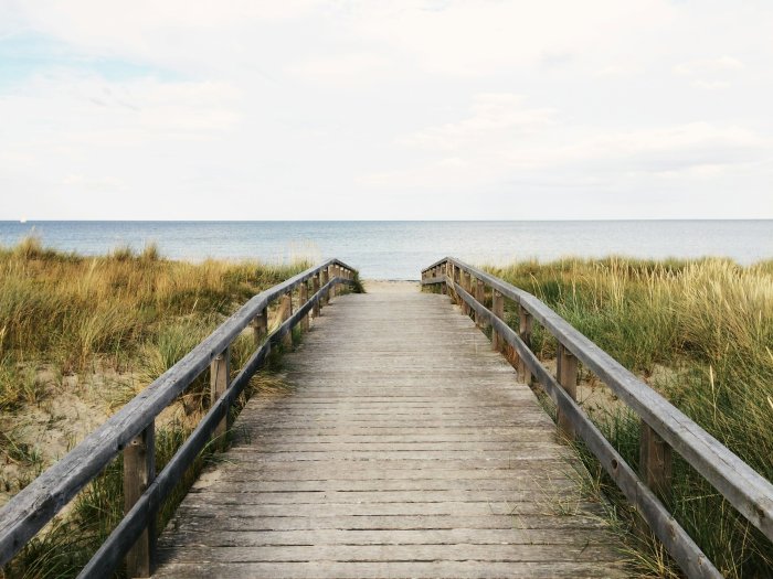 Wooden boardwalk leading to the ocean