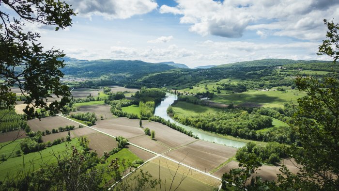 Aerial View of a River Winding Through a Valley