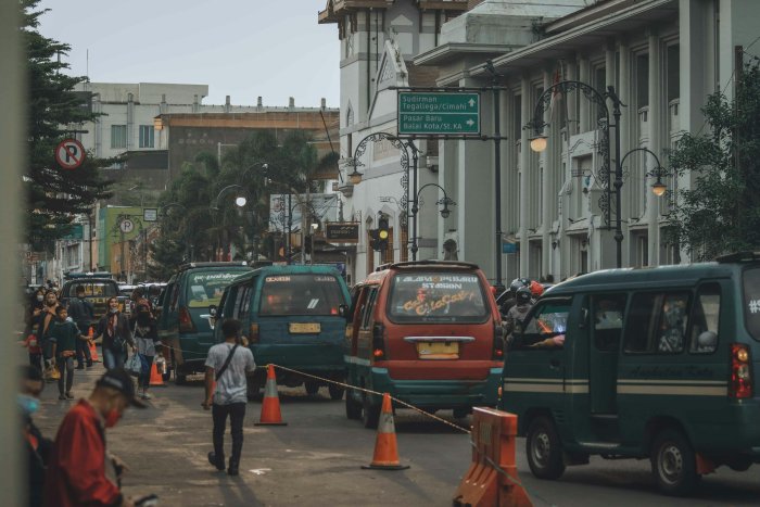 Busy Street with Angkot Minivans in Bandung Indonesia