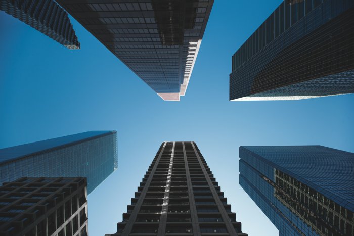 Low Angle View of Skyscrapers Against Blue Sky