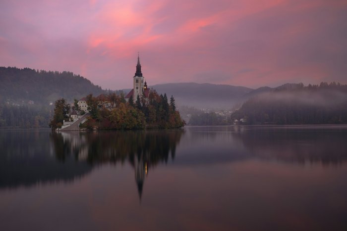 Foggy sunset over Lake Bled and its island church