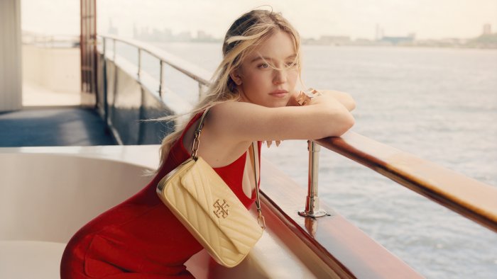 Sydney Sweeney in Red Dress with Tory Burch Bag