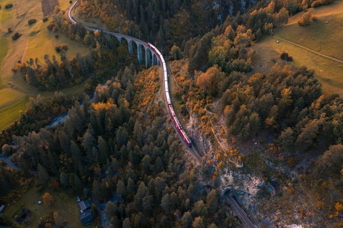 Aerial view of a train crossing Landwasser Viaduct