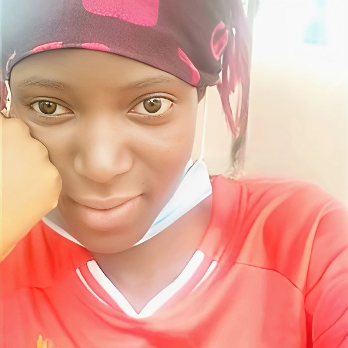 Young woman wearing a headscarf and red shirt