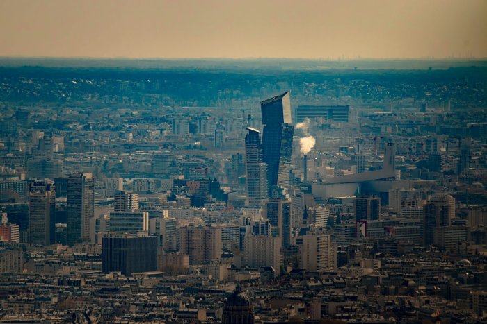 Aerial view of the dense Paris cityscape featuring Tours Duo