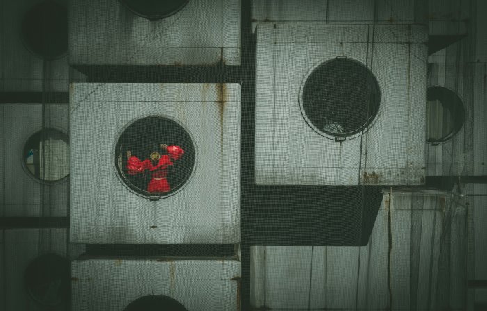 Person in red inside Nakagin Capsule Tower