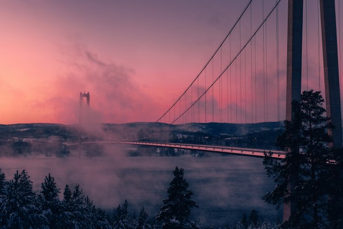 High Coast Bridge in pink winter fog