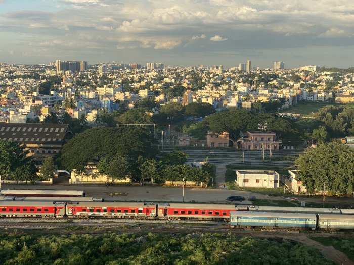 Wide Shot of City Skyline and Trains