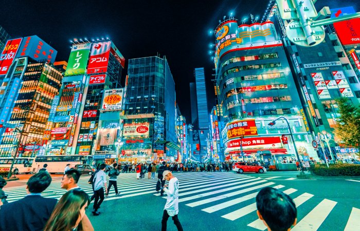 Pedestrians Crossing a Street in Shinjuku Tokyo
