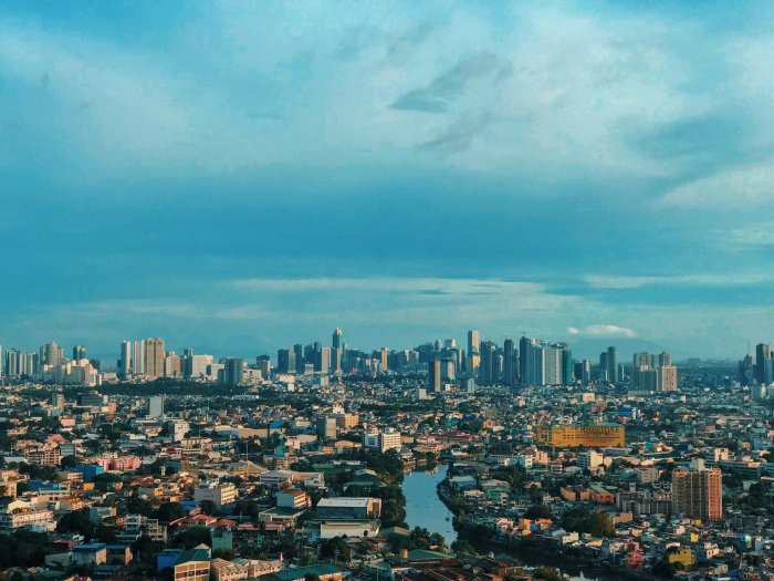 Dense City Skyline Under a Blue Sky