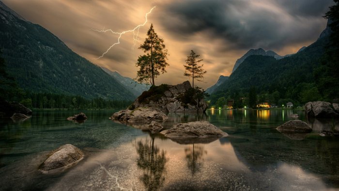 Pine trees on a rocky islet under a stormy sky