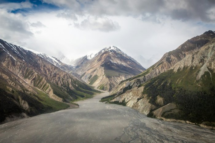 Braided river valley winding through rugged mountains