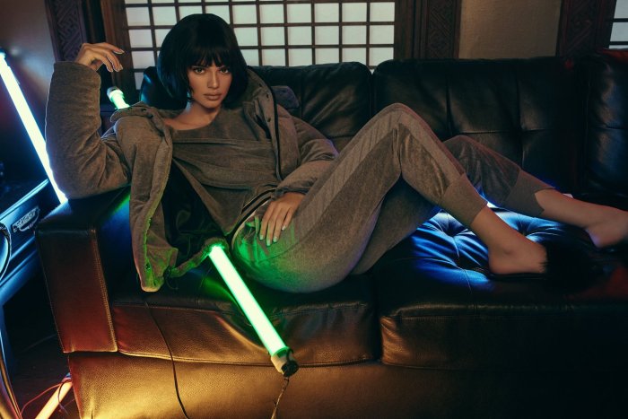 Kendall Jenner Reclining on a Leather Sofa with Neon Lights