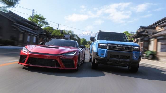 Red Toyota GR Sports Car and Blue Toyota Land Cruiser
