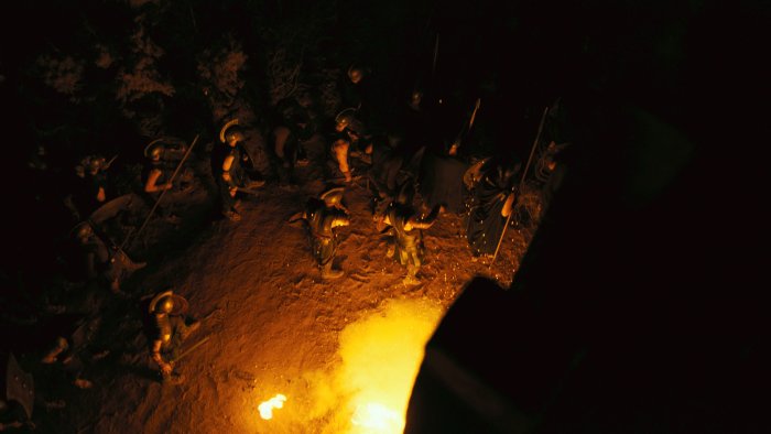 Greek soldiers gathered around a fire in The Odyssey