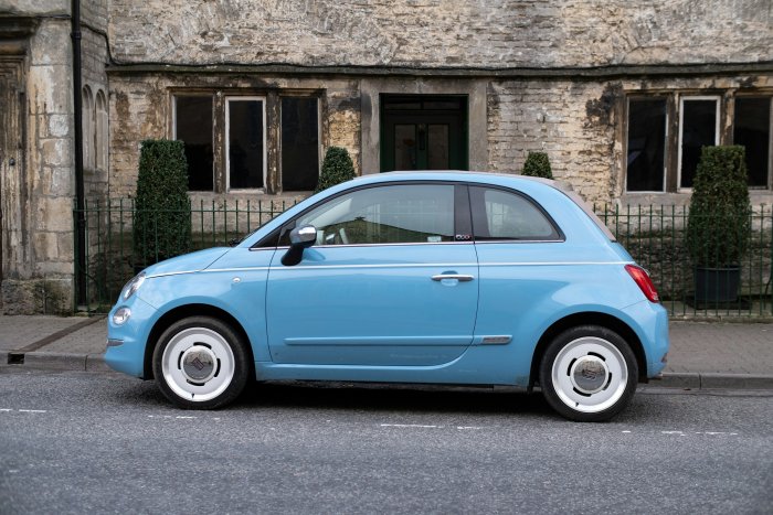Light Blue Fiat 500 Parked on Street