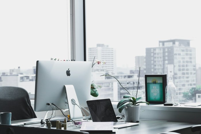 Modern Office Desk Setup with iMac and City View