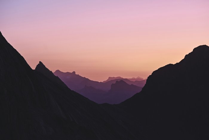 Silhouette of a mountain range at sunset