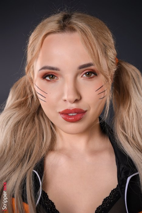 Blonde Woman Cosplaying Naruto Uzumaki from Naruto