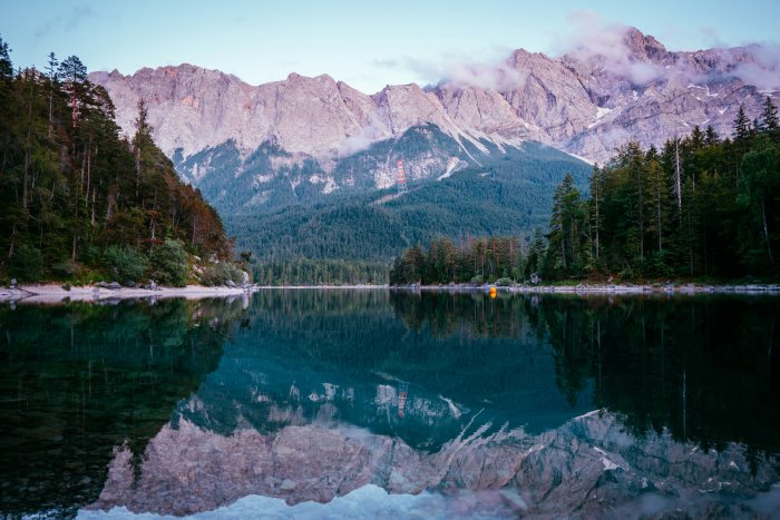 Mountain range reflected in a calm alpine lake