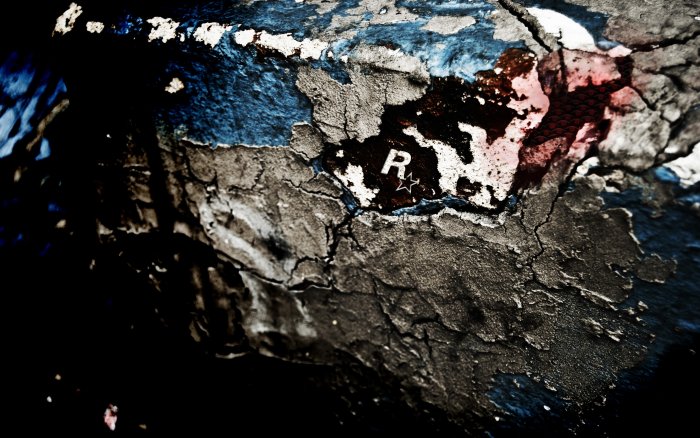 Gritty Rockstar Games Logo on Cracked Textured Surface