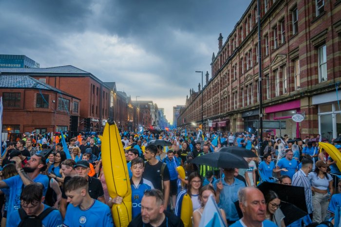 Manchester City Football Fans Parade on City Street