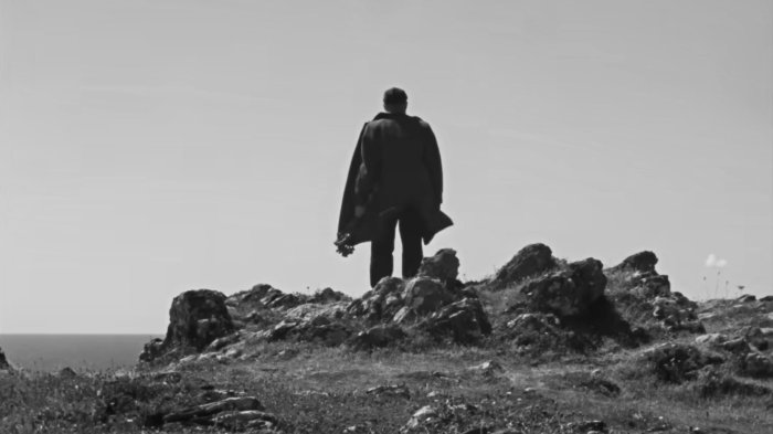 Man standing on a rocky hill in Rose of Nevada