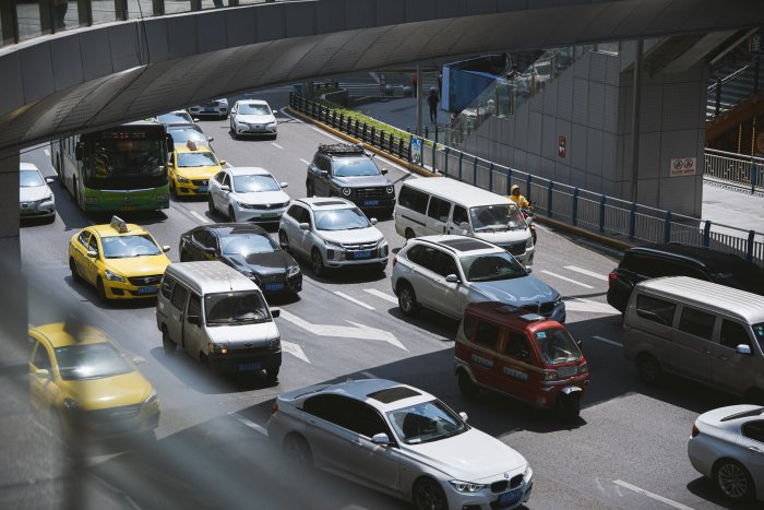 Busy city street filled with heavy vehicle traffic