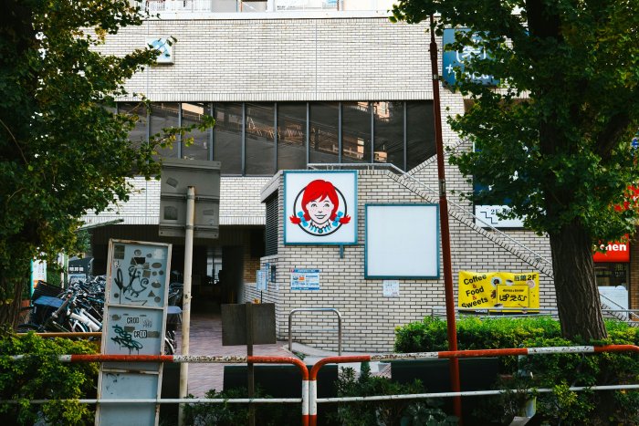 Wendy's Restaurant Sign on a Brick Building in Tokyo