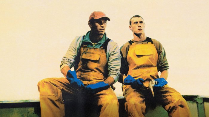 Two fishermen in yellow overalls from Rose of Nevada