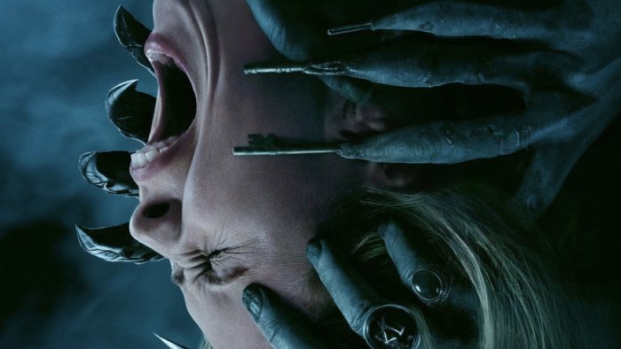KeyFace monster grabbing screaming woman in Insidious: The Last Key