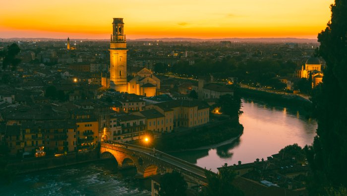 Verona city skyline with Ponte Pietra at sunset